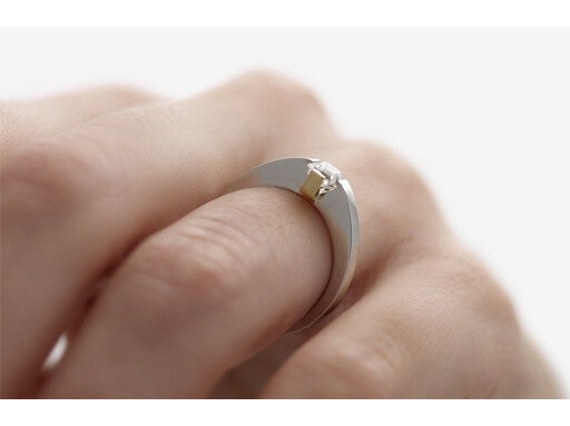 Adbridgd Assher Cut Diamond ring in platinum and 18ct yellow gold on hand