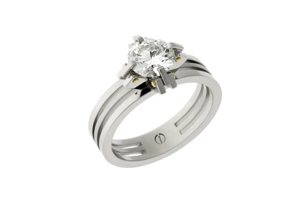 Designer claw setting platinum and gold round brilliant diamond engagement ring