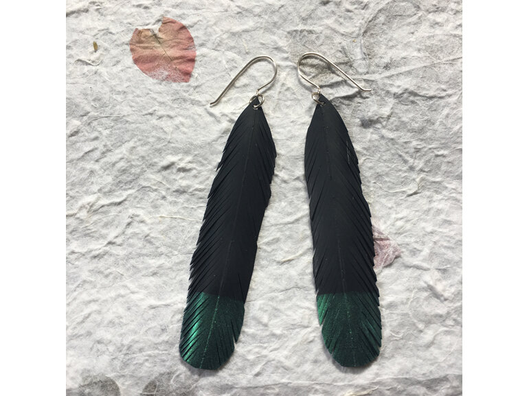 Hail earrings with emerald tips