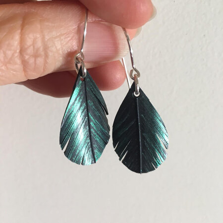 Tear drop earrings with emerald