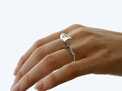 Wilshi tear tab proposal ring on the hand